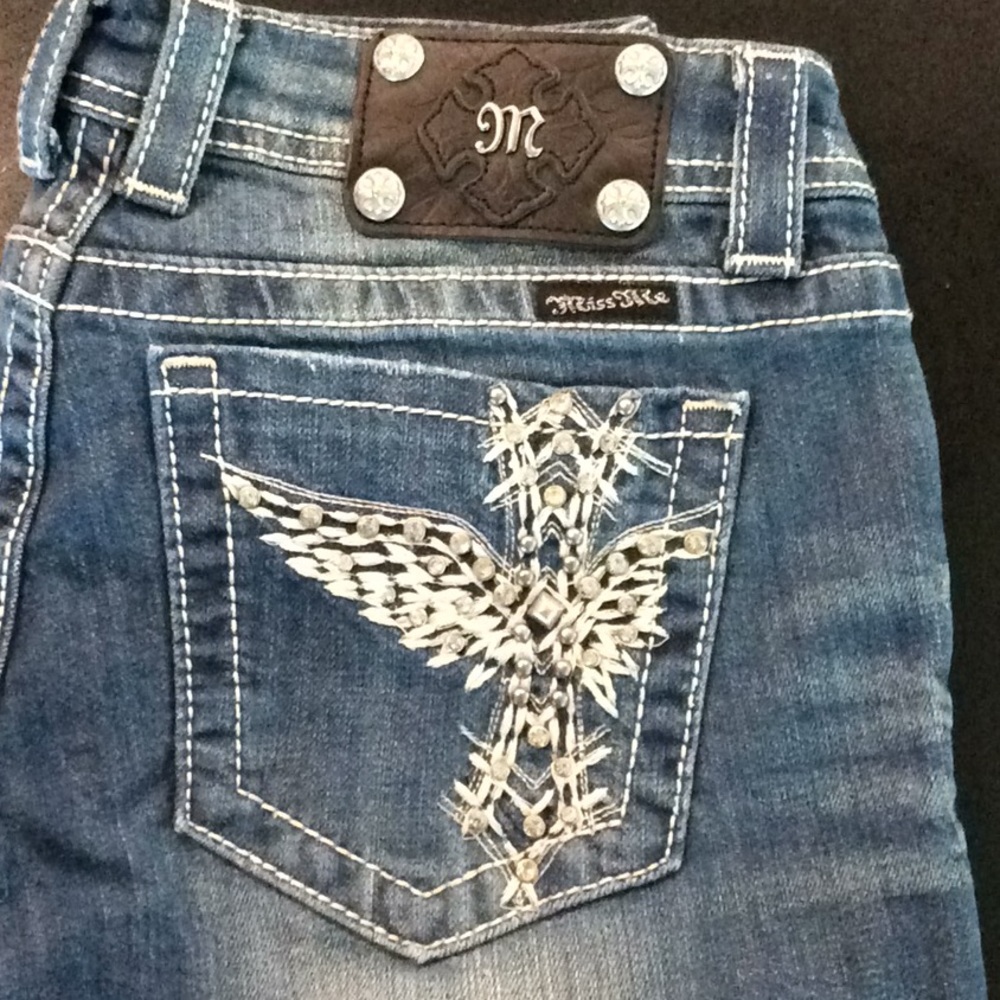 Miss Me Jeans with rhinestones stud & winged cross